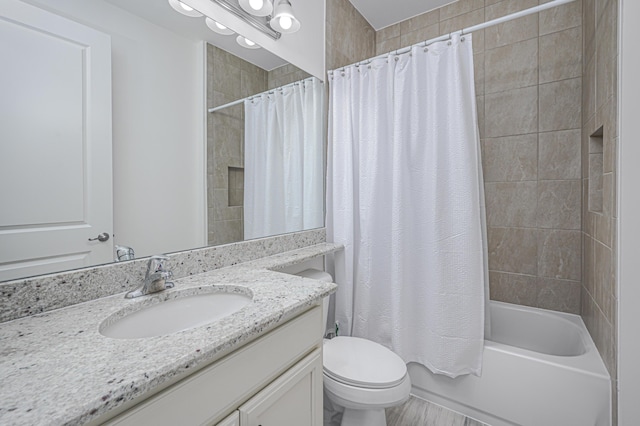 full bathroom with shower / bath combo, vanity, and toilet