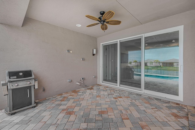 view of patio / terrace with area for grilling and ceiling fan