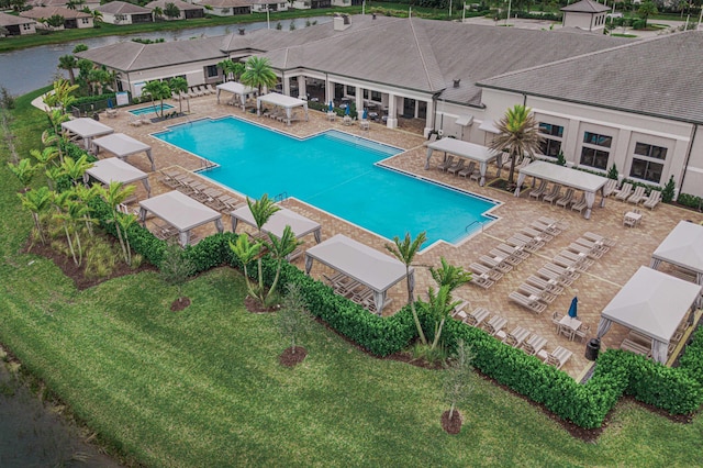 view of pool with a yard and a patio area