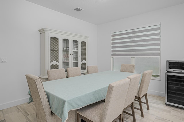 dining area featuring wine cooler