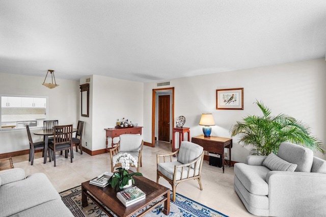 living room featuring a textured ceiling