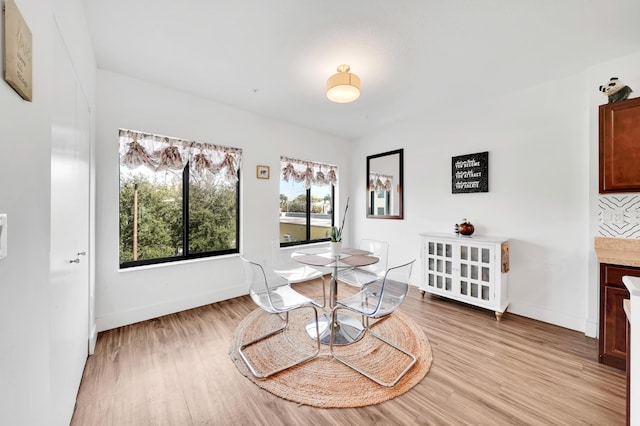 dining room with light wood-type flooring