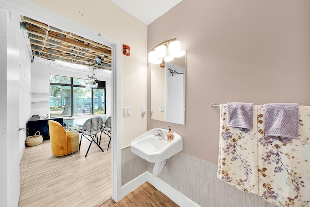 bathroom with hardwood / wood-style flooring