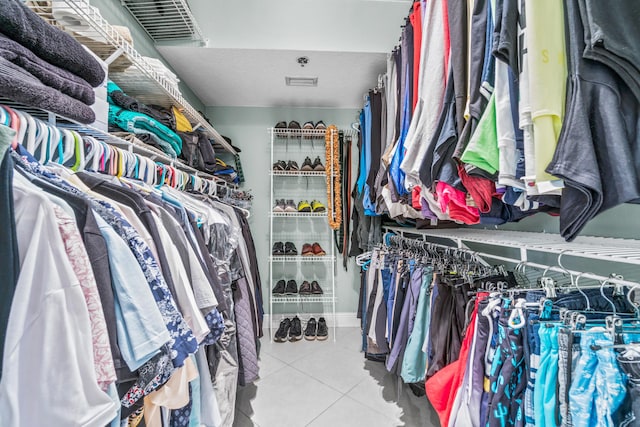 spacious closet featuring tile patterned flooring