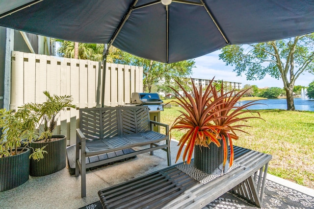 view of patio / terrace featuring a water view