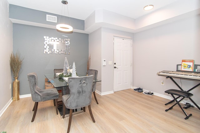 dining area with light hardwood / wood-style floors