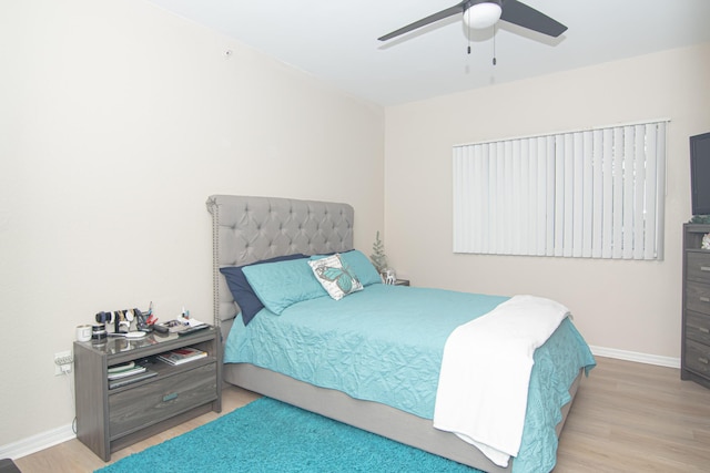 bedroom featuring hardwood / wood-style floors and ceiling fan