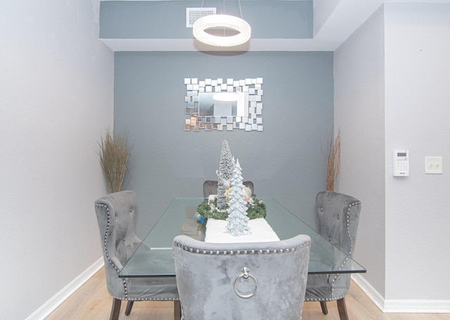 dining area with wood-type flooring