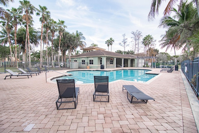 view of swimming pool featuring a patio area