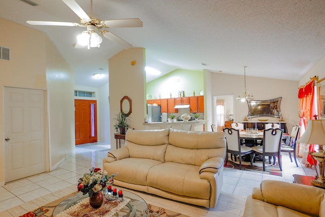 living room featuring light tile patterned floors, high vaulted ceiling, a textured ceiling, and ceiling fan