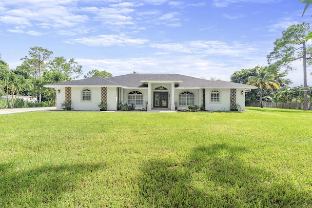 ranch-style home with a front lawn