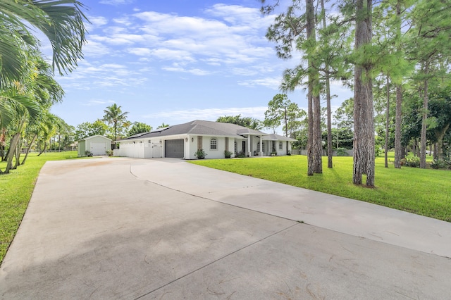 ranch-style home featuring a garage and a front lawn