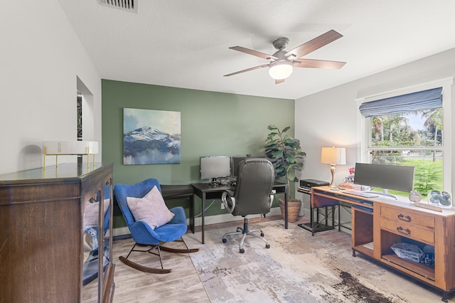 office space with ceiling fan and light wood-type flooring