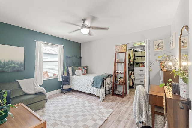 bedroom featuring ceiling fan and light hardwood / wood-style floors