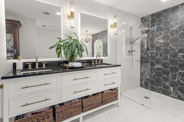 bathroom featuring tiled shower, vanity, a chandelier, and tile walls