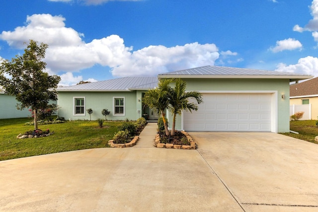 view of front of home featuring a front lawn and a garage