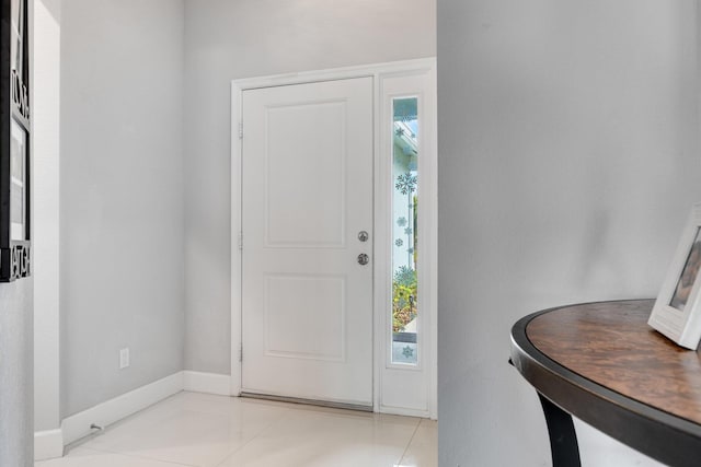 foyer entrance with light tile patterned flooring