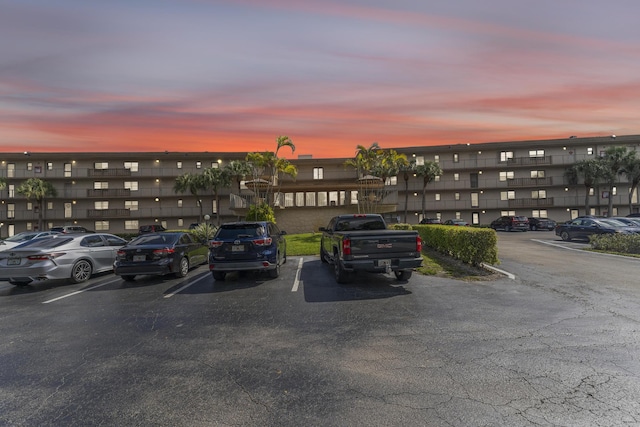 view of parking at dusk