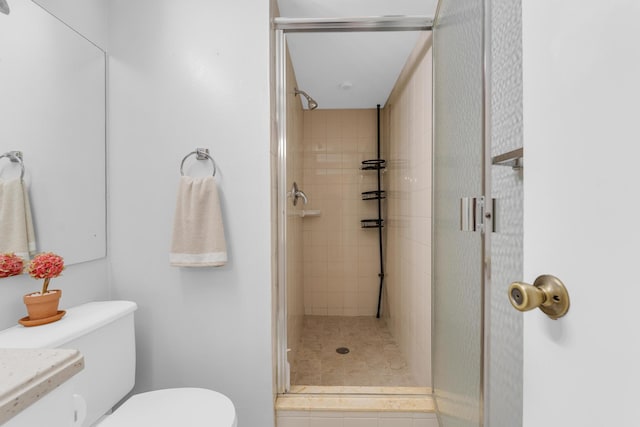 bathroom featuring walk in shower and toilet