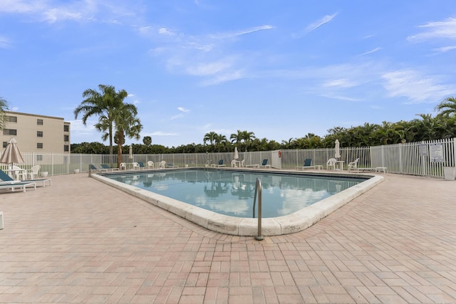 view of swimming pool with a patio area