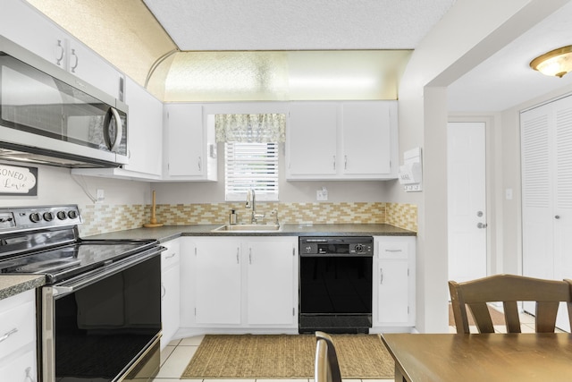 kitchen with white cabinetry, appliances with stainless steel finishes, and sink