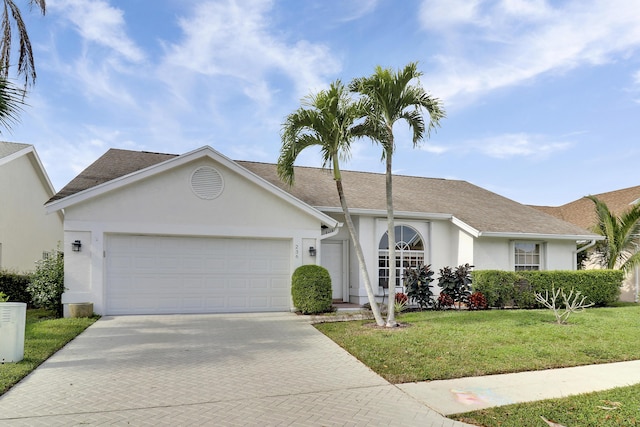 single story home with a garage and a front yard