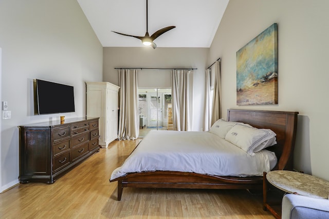 bedroom with access to outside, ceiling fan, light hardwood / wood-style flooring, and vaulted ceiling