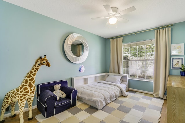 bedroom featuring ceiling fan and light wood-type flooring