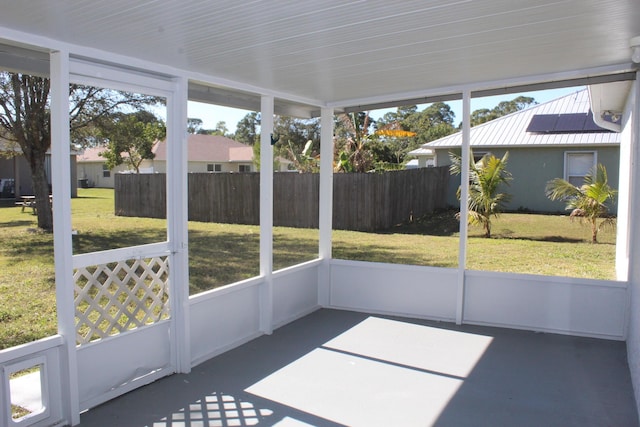 unfurnished sunroom featuring a wealth of natural light