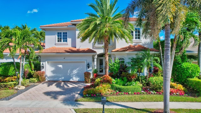 mediterranean / spanish-style house featuring a garage