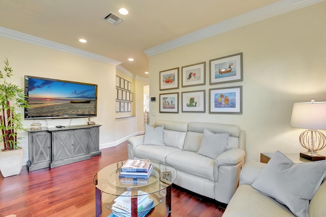 living room with hardwood / wood-style floors and crown molding