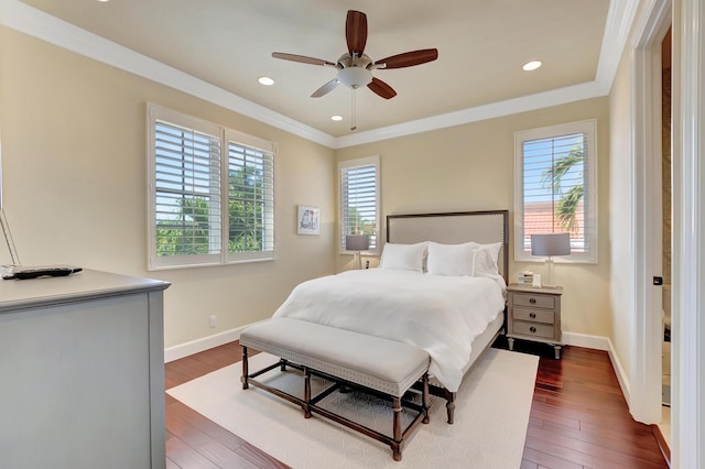 bedroom featuring ceiling fan, ornamental molding, and dark wood-type flooring