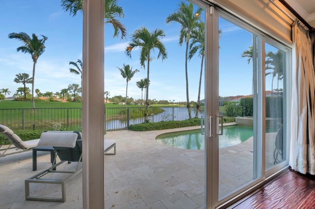 doorway featuring french doors and a water view