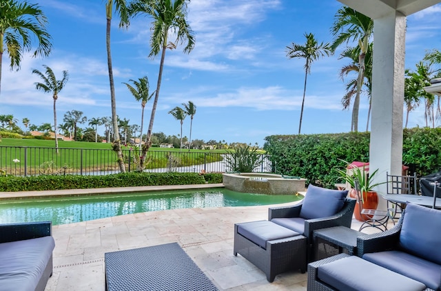 view of swimming pool with an in ground hot tub and a patio