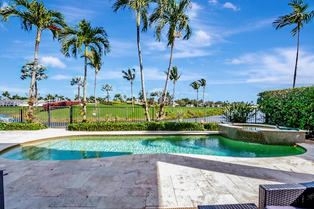 view of pool featuring an in ground hot tub and a patio