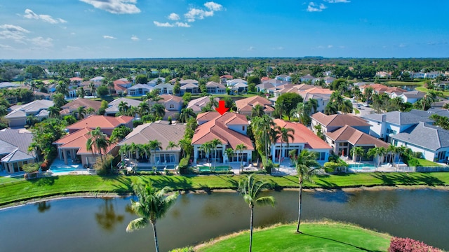 birds eye view of property with a water view