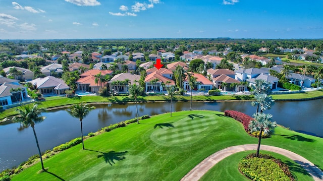 drone / aerial view featuring a water view and a residential view