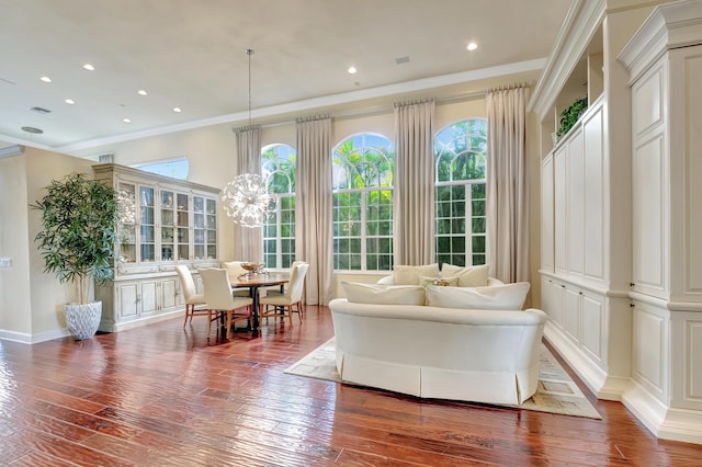 interior space with wood-type flooring and crown molding