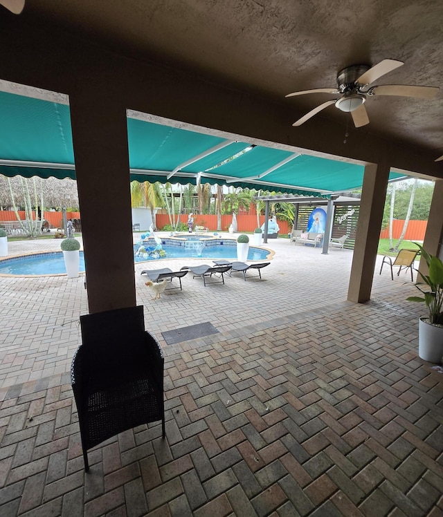 view of pool with a patio area and ceiling fan