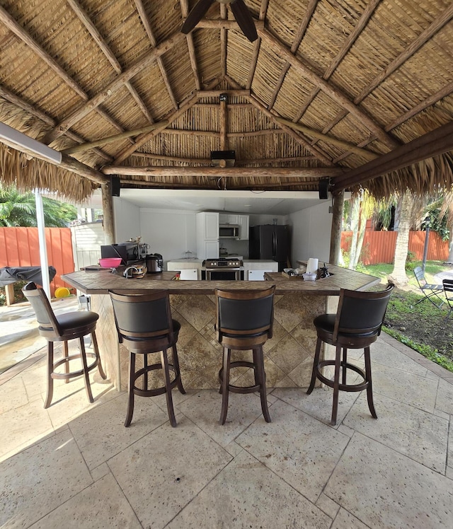view of patio / terrace with a bar and a gazebo