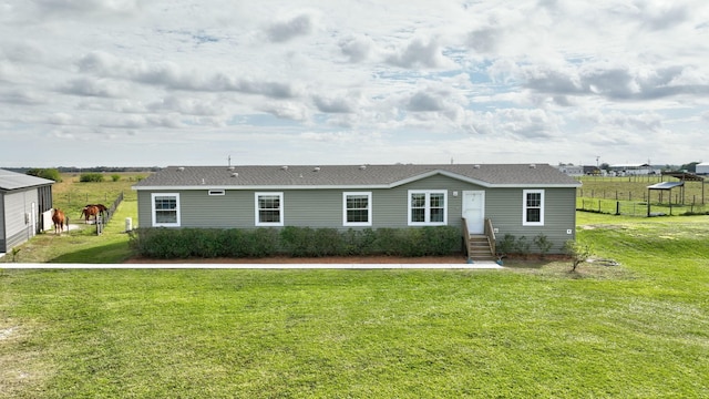 ranch-style home with a front yard