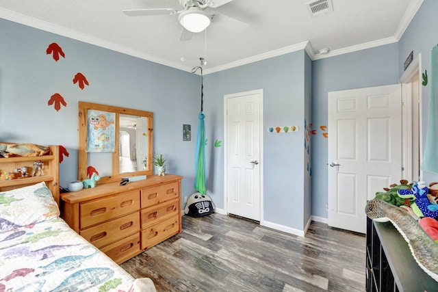 bedroom with ceiling fan, crown molding, and dark wood-type flooring