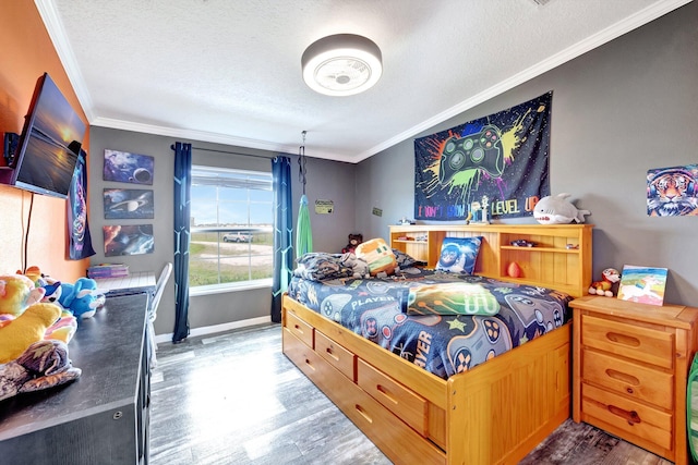 bedroom featuring ornamental molding, a textured ceiling, and dark wood-type flooring