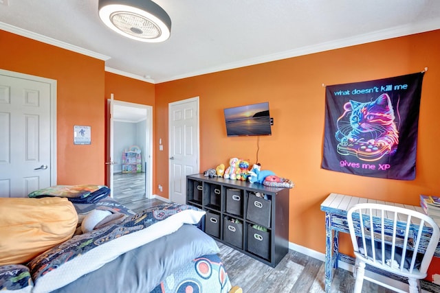 bedroom with hardwood / wood-style flooring and ornamental molding