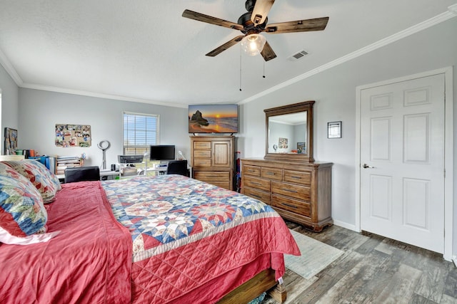 bedroom featuring dark hardwood / wood-style floors, ceiling fan, and ornamental molding