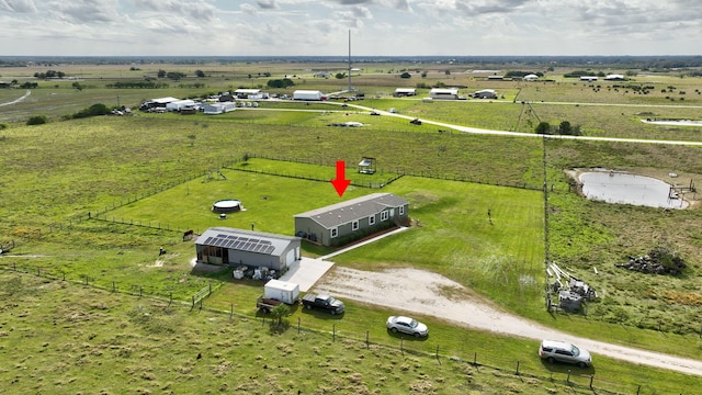 birds eye view of property with a rural view