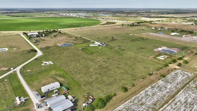 birds eye view of property featuring a rural view