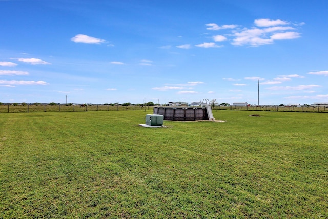 view of yard with a rural view