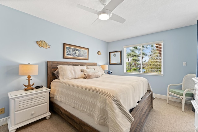 bedroom with light colored carpet and ceiling fan