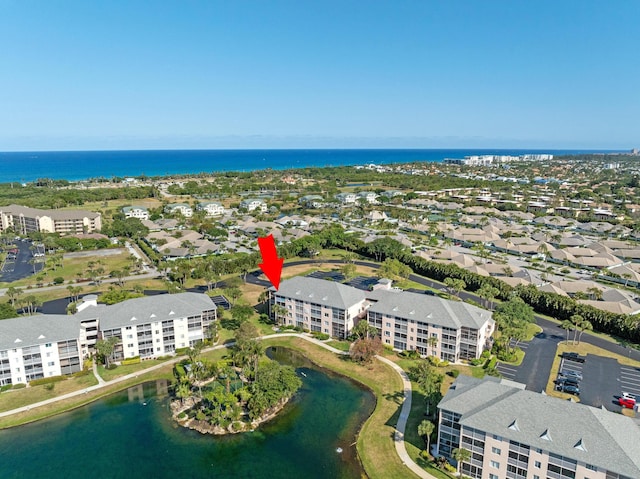 birds eye view of property featuring a water view